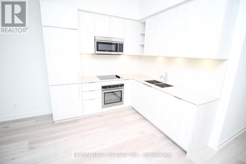 323 - 50 Ordnance Street, Toronto, ON - Indoor Photo Showing Kitchen With Double Sink