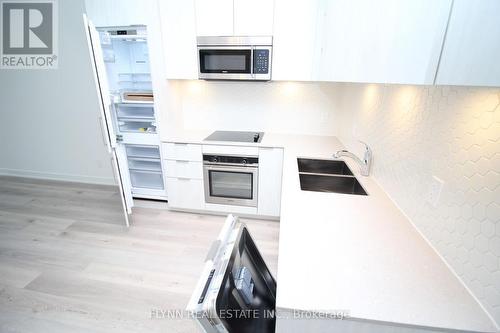 323 - 50 Ordnance Street, Toronto, ON - Indoor Photo Showing Kitchen With Double Sink