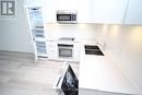 323 - 50 Ordnance Street, Toronto, ON  - Indoor Photo Showing Kitchen With Double Sink 