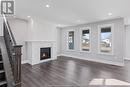 19 Belleview Drive, Kingsville, ON  - Indoor Photo Showing Living Room With Fireplace 