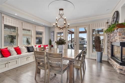 1169 Bellagio Avenue, Kelowna, BC - Indoor Photo Showing Dining Room With Fireplace