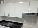 Kitchen featuring white cabinetry - 660 Main Street E Unit# 2, Hamilton, ON  - Indoor Photo Showing Kitchen With Double Sink 