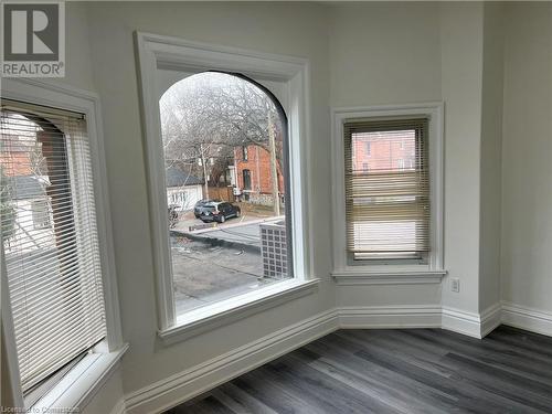 Room details featuring hardwood / wood-style flooring - 660 Main Street E Unit# 2, Hamilton, ON - Indoor Photo Showing Other Room