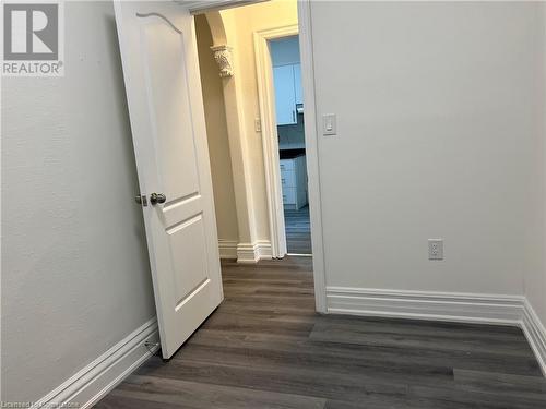 Hall featuring dark hardwood / wood-style flooring - 660 Main Street E Unit# 2, Hamilton, ON - Indoor Photo Showing Other Room