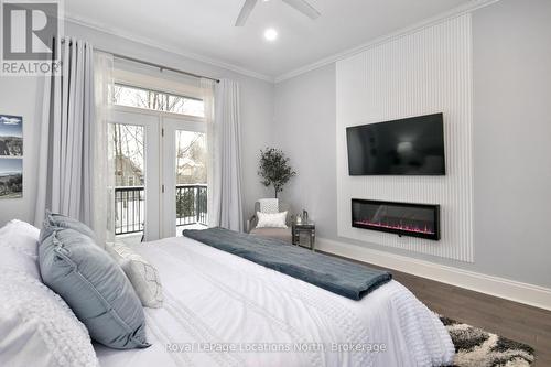 107 Hoggard Court, Blue Mountains (Thornbury), ON - Indoor Photo Showing Bedroom With Fireplace