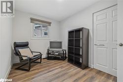 Living area featuring dark wood-type flooring - 