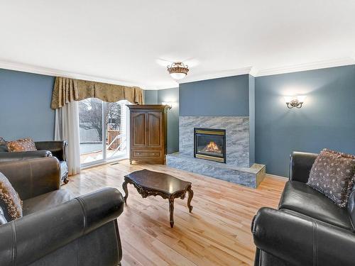 Living room - 16 Rue Des Légendes, Saint-Jean-Sur-Richelieu, QC - Indoor Photo Showing Living Room With Fireplace