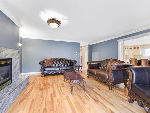 Living room - 16 Rue Des Légendes, Saint-Jean-Sur-Richelieu, QC - Indoor Photo Showing Living Room With Fireplace