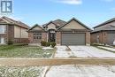 View of front of home featuring a front yard and a garage - 46 Halliday Drive Drive, Tavistock, ON  - Outdoor With Facade 