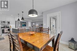 Dining room with light tile patterned flooring - 