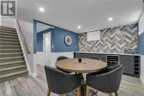 Dining space featuring light hardwood / wood-style flooring and beverage cooler - 46 Halliday Drive Drive, Tavistock, ON - Indoor Photo Showing Dining Room