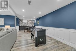 Game room featuring light hardwood / wood-style floors - 