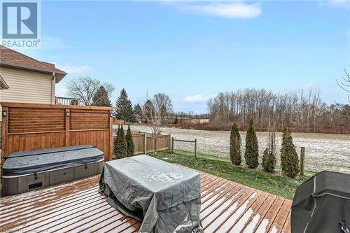 Wooden terrace featuring area for grilling and a hot tub - 46 Halliday Drive Drive, Tavistock, ON - Outdoor With Deck Patio Veranda With Exterior