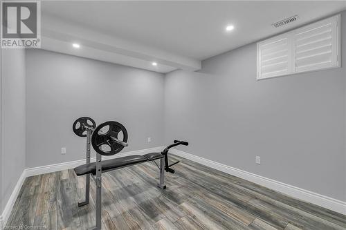 Exercise room featuring wood-type flooring - 46 Halliday Drive Drive, Tavistock, ON - Indoor