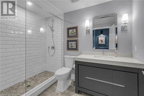 Bathroom featuring a tile shower, vanity, toilet, and tile patterned floors - 46 Halliday Drive Drive, Tavistock, ON - Indoor Photo Showing Bathroom