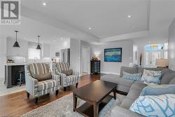 Living room featuring sink and light hardwood / wood-style floors - 