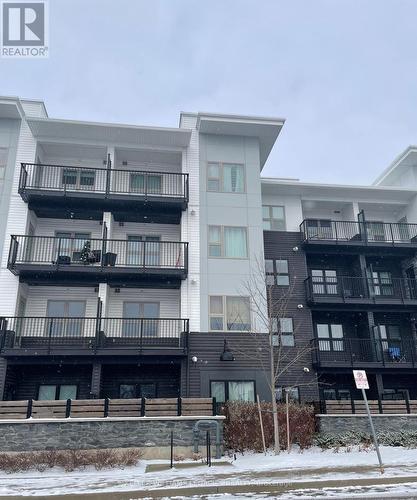 310 - 110 Fergus Avenue, Kitchener, ON - Outdoor With Balcony With Facade