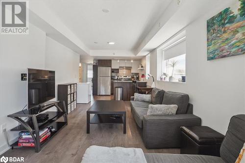 Living room with wood-type flooring - 1141 Cooke Boulevard Unit# 416, Burlington, ON - Indoor Photo Showing Living Room