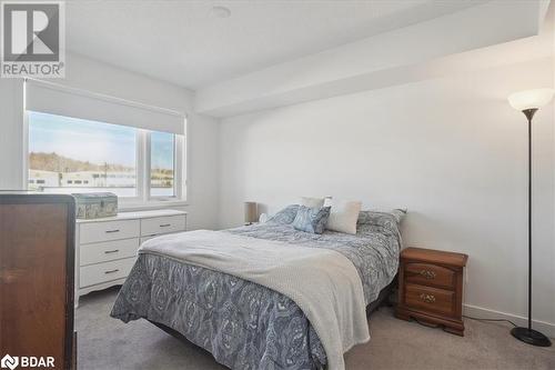 View of carpeted bedroom - 1141 Cooke Boulevard Unit# 416, Burlington, ON - Indoor Photo Showing Bedroom