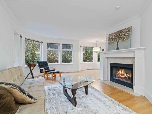 206C-4678 Elk Lake Dr, Saanich, BC - Indoor Photo Showing Living Room With Fireplace