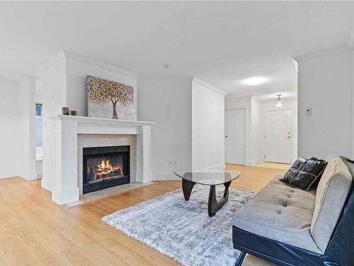 206C-4678 Elk Lake Dr, Saanich, BC - Indoor Photo Showing Living Room With Fireplace