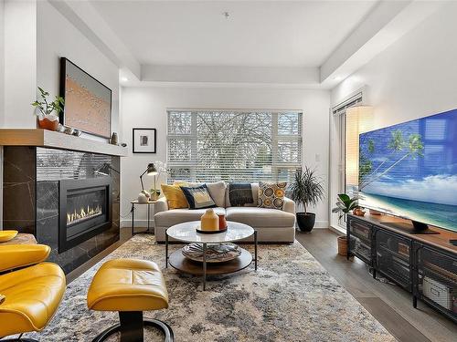 309-9861 Third St, Sidney, BC - Indoor Photo Showing Living Room With Fireplace