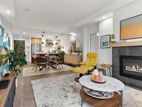 309-9861 Third St, Sidney, BC - Indoor Photo Showing Living Room With Fireplace