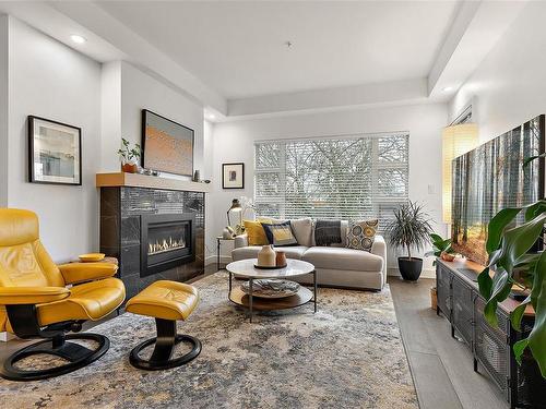 309-9861 Third St, Sidney, BC - Indoor Photo Showing Living Room With Fireplace