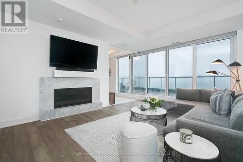 1002 - 128 Pears Avenue, Toronto, ON - Indoor Photo Showing Living Room With Fireplace