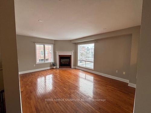 65-5335 Glen Erin Dr, Mississauga, ON - Indoor Photo Showing Living Room With Fireplace