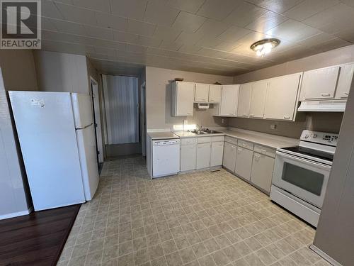 5231 44 Street, Fort Nelson, BC - Indoor Photo Showing Kitchen With Double Sink