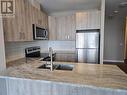 1710 - 104 Garment Street, Kitchener, ON  - Indoor Photo Showing Kitchen With Double Sink With Upgraded Kitchen 