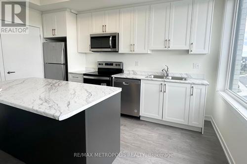 1703 - 160 Densmore Road, Cobourg, ON - Indoor Photo Showing Kitchen With Stainless Steel Kitchen With Double Sink