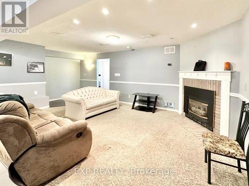 Bsmt - 52 Waywell Street N, Whitby, ON - Indoor Photo Showing Living Room With Fireplace