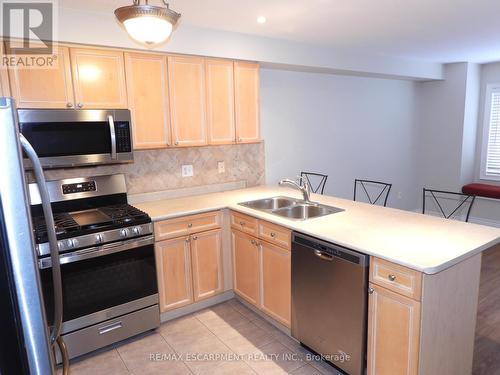 123 - 710 Spring Gardens Road, Burlington, ON - Indoor Photo Showing Kitchen With Double Sink