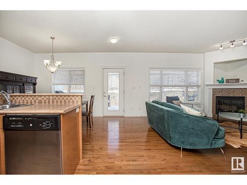 #127 89 Rue Monette, Beaumont, AB - Indoor Photo Showing Living Room With Fireplace