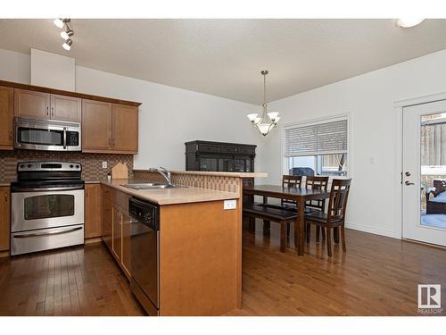 #127 89 Rue Monette, Beaumont, AB - Indoor Photo Showing Kitchen With Double Sink