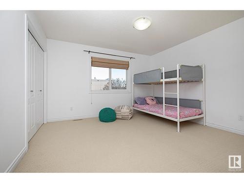 #127 89 Rue Monette, Beaumont, AB - Indoor Photo Showing Bedroom