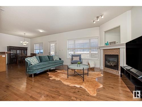 #127 89 Rue Monette, Beaumont, AB - Indoor Photo Showing Living Room With Fireplace