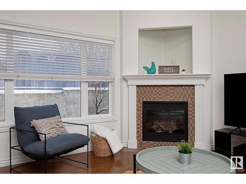 #127 89 Rue Monette, Beaumont, AB - Indoor Photo Showing Living Room With Fireplace