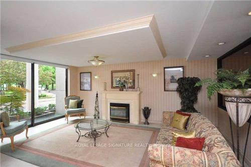 2007-3700 Kaneff Cres, Mississauga, ON - Indoor Photo Showing Living Room With Fireplace