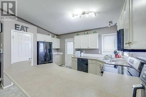 127 Kirkland Close, Red Deer, AB - Indoor Photo Showing Kitchen With Double Sink