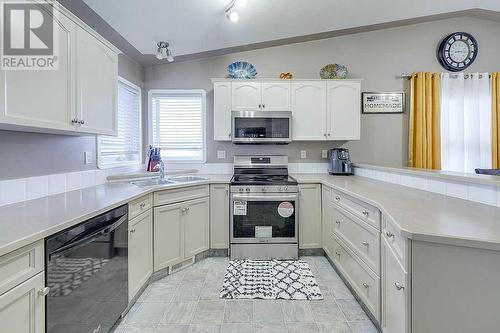 127 Kirkland Close, Red Deer, AB - Indoor Photo Showing Kitchen With Double Sink