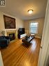 #2 - 79 Rosemount Avenue, Toronto, ON  - Indoor Photo Showing Living Room With Fireplace 