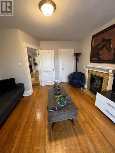 #2 - 79 Rosemount Avenue, Toronto, ON - Indoor Photo Showing Living Room With Fireplace