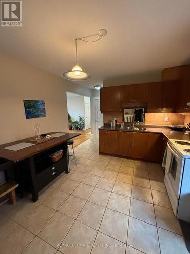 #2 - 79 Rosemount Avenue, Toronto, ON - Indoor Photo Showing Kitchen With Double Sink