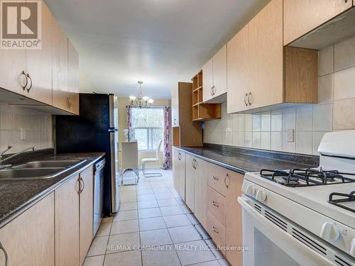 Upper - 12 Moonbeam Grove, Toronto, ON - Indoor Photo Showing Kitchen With Double Sink