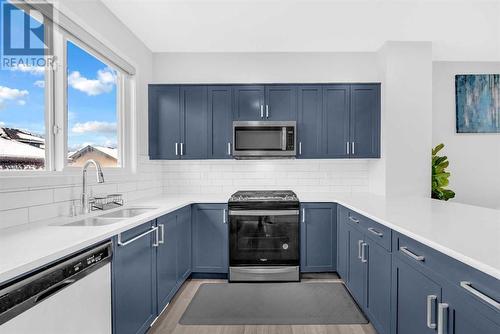 221 Belmont Street Sw, Calgary, AB - Indoor Photo Showing Kitchen With Double Sink With Upgraded Kitchen