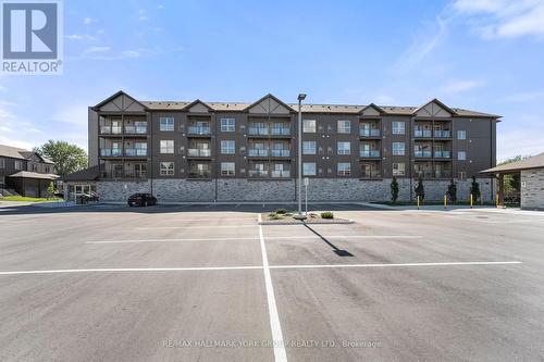 306 - 110 Grew Boulevard, Georgina, ON - Outdoor With Balcony With Facade