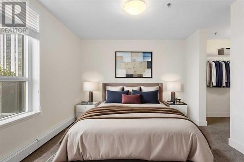 VR-Staged - 319, 955 Mcpherson Road Ne, Calgary, AB - Indoor Photo Showing Bedroom